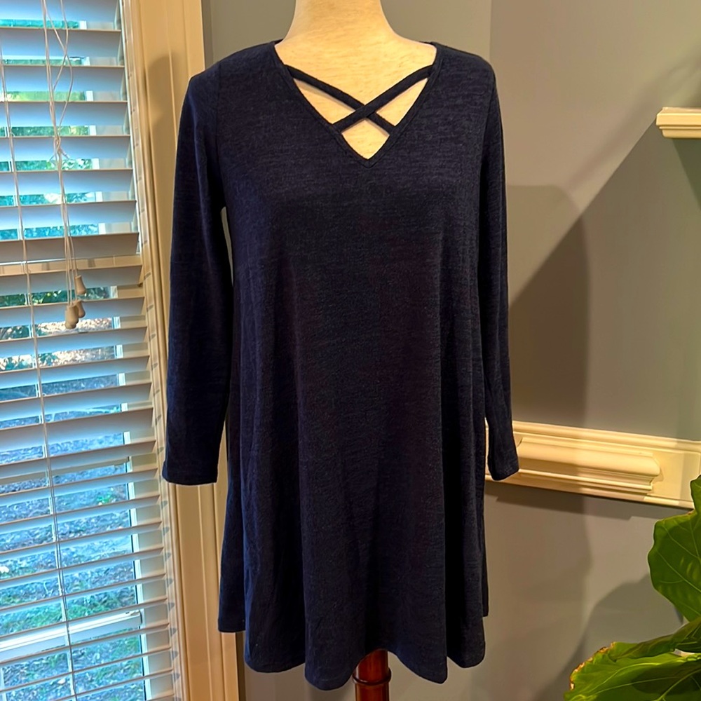 Pink blush blue lined dress with criss cross detail fits like a medium.